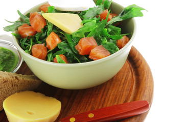 salad with salmon in green bowl