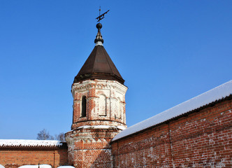Fototapeta na wymiar Wall tower of the St. Nicholas Berlyukovsky Monastery