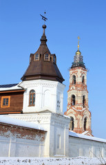 Fototapeta na wymiar Belfry and wall tower of the St Nicholas Berlyukovsky Monastery