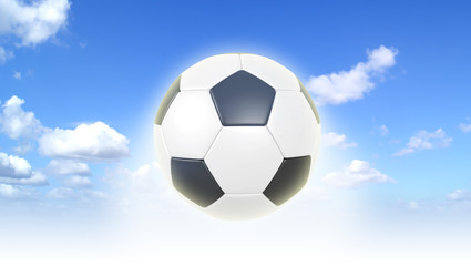 Fototapeta na wymiar Piłka nożna na tle błękitnego nieba