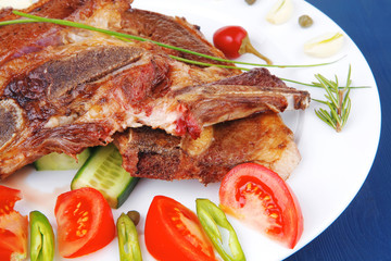 beef meat fillet on white plate with tomatoes