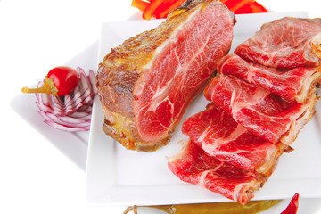 served meat chunk with rolls  on white