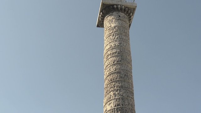 Column of Marcus Aurelius in square, Rome, Italy with blue sky