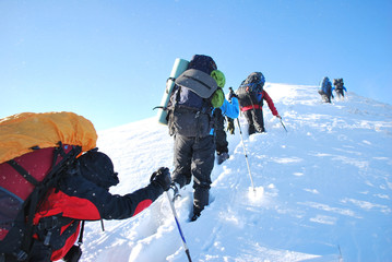 Hike in winter mountain