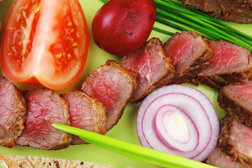 meat food : roast red meat slices served on green plate