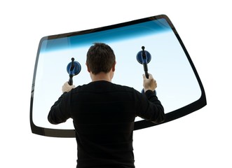 man holding up the windshield