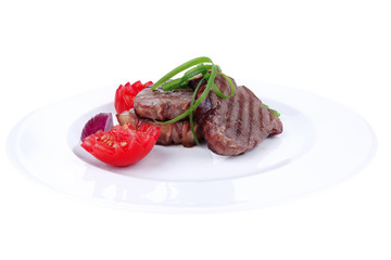 beef steaks strips on white plate