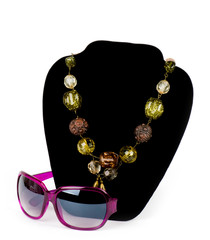 Fashionable bijouterie and glasses on white background
