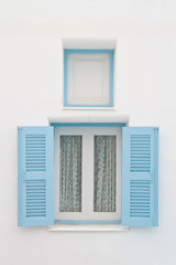 Blue window on white house