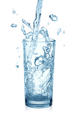 puring water on a glass on white background