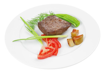 meat food : roasted fillet mignon on white plate with tomatoes a