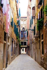 Zelfklevend Fotobehang Venice - Picturesque narrow street © Jenifoto
