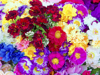 background of colorful artificial flowers