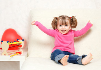 Fototapeta premium little girl playing with toys