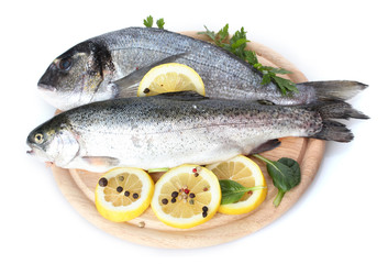 Fresh fishes with lemon, parsley and spice