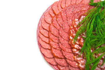 sausage with herbs on plate on white