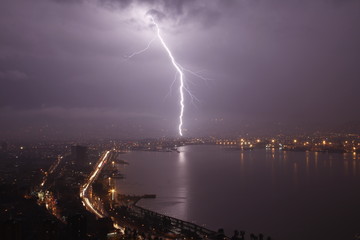 Fototapeta na wymiar powerful thunderbolt on city