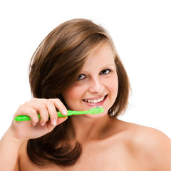 Attractive woman brushing teeth isolated on white background