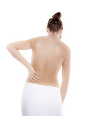 Naklejka premium Woman massaging pain back isolated on white background