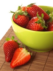 Strawberries in a green bowl, closeup
