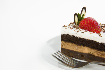 Piece of chocolate cake with strawberry decorate on top