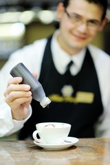 Barista prepares cappuccino