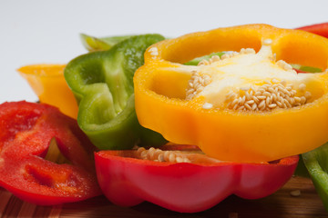 close up of red, yellow and green peppers