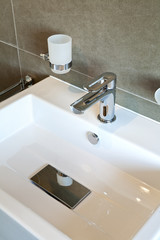 Fototapeta premium modern bathroom sink in white ceramic
