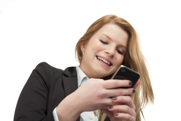 junge blonde Frau business look mit smartphone