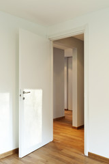 interior empty room, white walls, open door