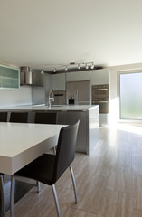 beautiful modern house, view of kitchen with dining table