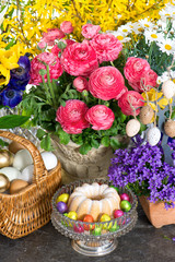 beautiful spring flowers with easter cake and eggs decoration