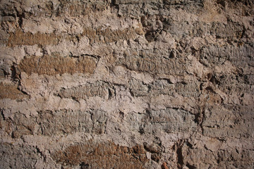 Weathered old brick wall with scratches