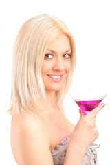 Obraz na płótnie Canvas A beautiful woman drinking a cocktail