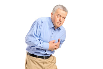 A senior man having a heart attack