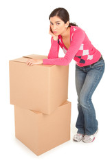 Tired Looking Woman Leaning on Boxes
