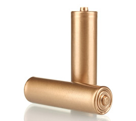 two golden batteries isolated on white