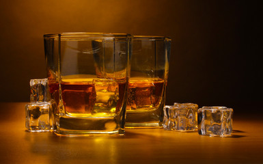 two glasses of scotch whiskey and ice
