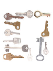 Many metal keys isolated on white