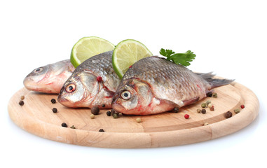 Fresh fishes with lime, parsley and spice