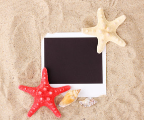 Photo with seashells and starfish on sand