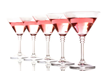 Red cocktail in martini glasses isolated on white
