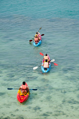 Fototapeta premium traveler kayaking in the thai ocean from backward view