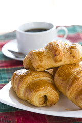 Breakfast with a cup of black coffee and croissants, Shallow DOF