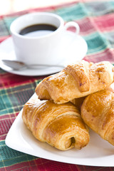 Breakfast with a cup of black coffee and croissants, Shallow DOF