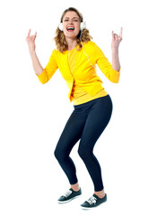 Beautiful woman with headphones tuned into music