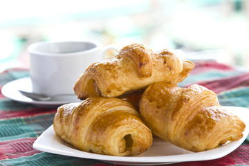 Breakfast with a cup of black coffee and croissants, Shallow DOF