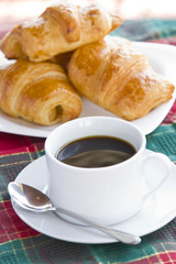 Breakfast with a cup of black coffee and croissants, Shallow DOF