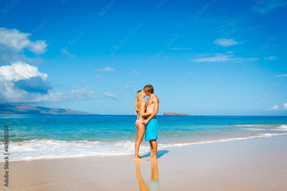 Wall mural Young Couple on Tropical Beach