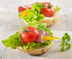 Sandwiches with  ham, lettuce and tomato